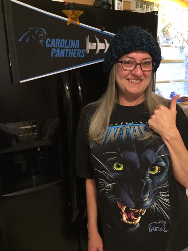 Happy Panthers fan in her football inspired crochet beanie