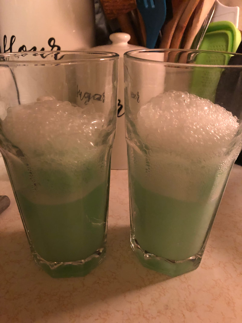 St. Patrick's Day Green Cocktail with Lime Sherbet, Sprite, and White Rum